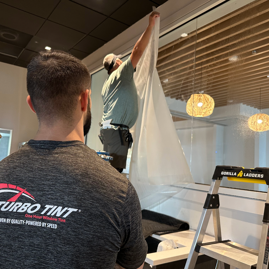 turbo tint workers applying window tint to office windows